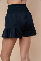 White Birch Women's High Waisted Smocked Shorts with Ruffle Hem