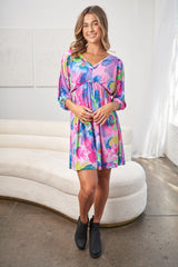 Chic White Birch Full Size V-Neck Tie Back Mini Dress with Eye-Catching Print