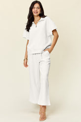 Trendy Full Size Two-Piece Texture Half Zip Short Sleeve Top & Pants Set with Pockets