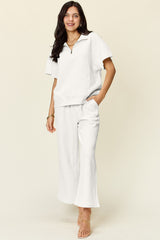 Trendy Full Size Two-Piece Texture Half Zip Short Sleeve Top & Pants Set with Pockets