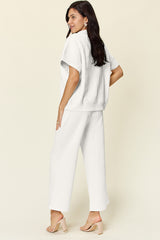 Trendy Full Size Two-Piece Texture Half Zip Short Sleeve Top & Pants Set with Pockets