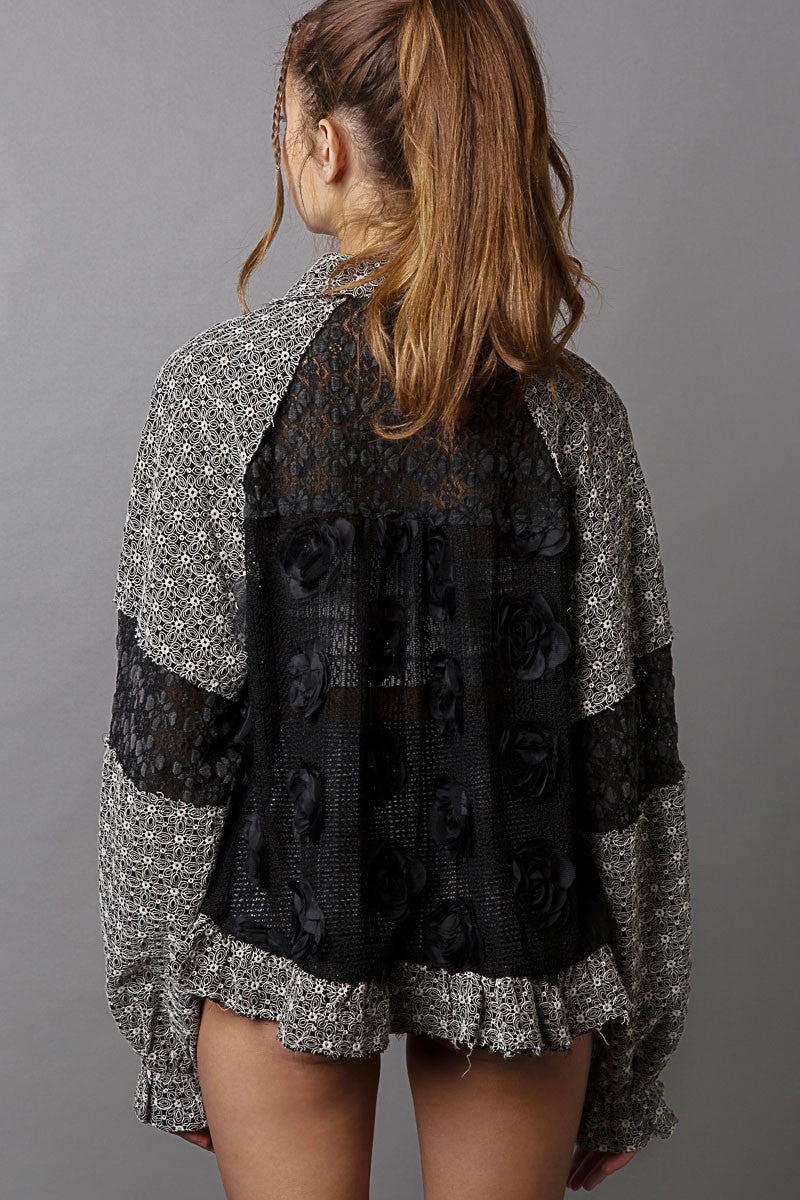 Back view of POL Eyelet Flower Pearl Detail Lace Patchwork Shirt showcasing intricate lace and patchwork design.