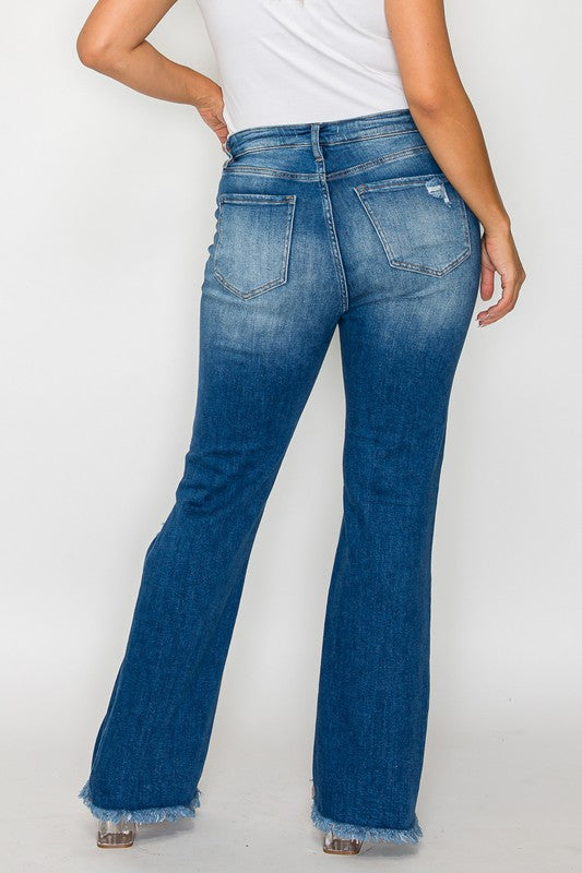 Back view of bytos Full Size Raw Hem Distressed High Rise Bootcut Jeans showcasing the unique raw hem and distressed detailing.