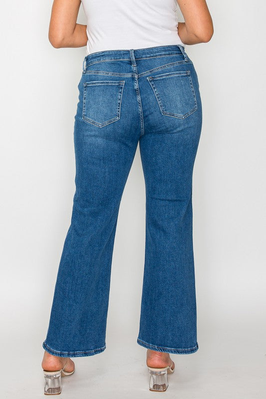 Woman wearing bytos Cat's Whiskers mid-rise ankle jeans, showcasing the back view and stylish flared design.