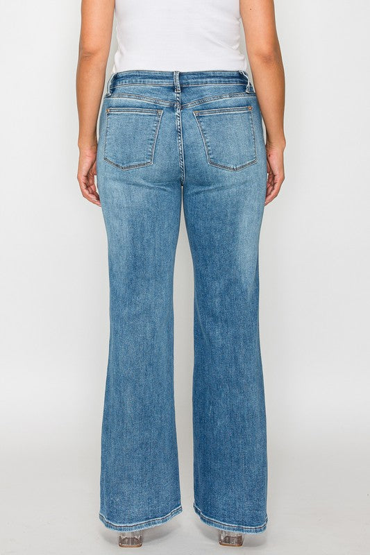 Back view of bytos Cat's Whiskers mid rise bootcut jeans in light blue, showcasing their elegant bootcut design.