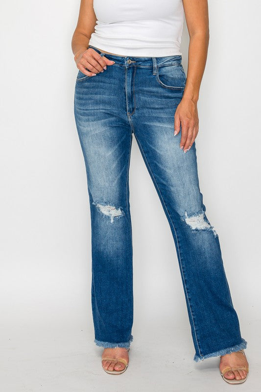 Full size distressed bootcut jeans with raw hem, styled with a fitted top and heeled sandals for a trendy look.