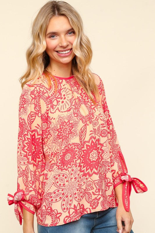 Elegant Floral Blouse with Ribbon Bow Detail and Round Neck | Haptics