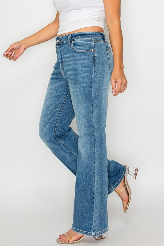 Woman wearing bytos Cat's Whiskers Mid Rise Bootcut Jeans, showcasing a flattering fit and stylish denim design.