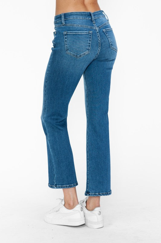 Model showcasing the bytos Cat's Whiskers mid-rise ankle jeans from the back, featuring a sleek denim design.