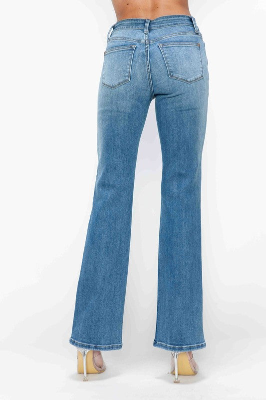 Back view of bytos Cat's Whiskers Mid Rise Bootcut Jeans in light wash, featuring a flattering bootcut design.